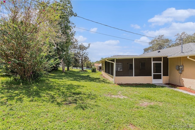 view of yard with a sunroom