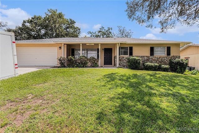 ranch-style home with a garage and a front yard