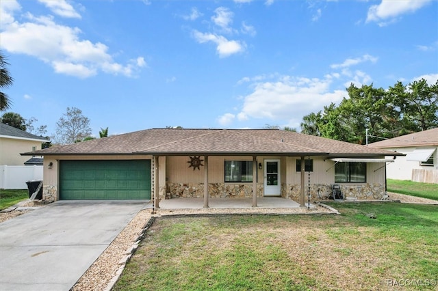 ranch-style house with a porch, a garage, and a front lawn