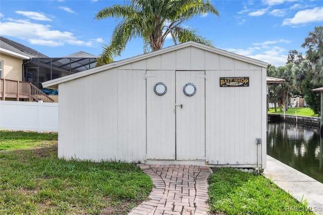 view of outbuilding with a water view