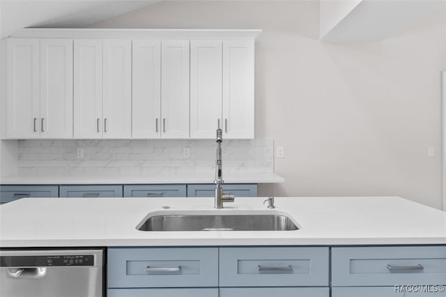 kitchen featuring white cabinets, backsplash, dishwasher, and sink