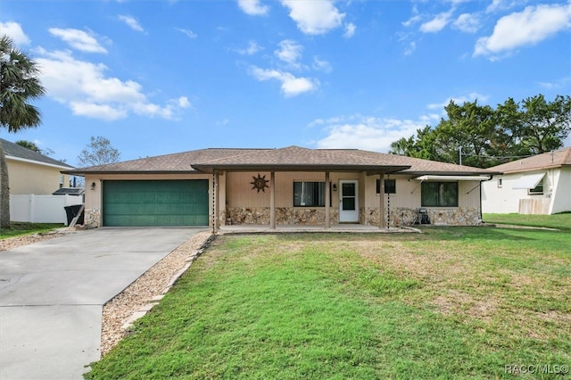 single story home with a front yard, a porch, and a garage