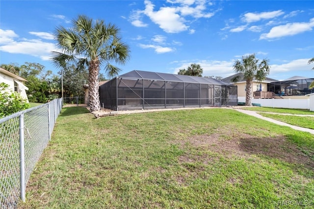 view of yard with glass enclosure