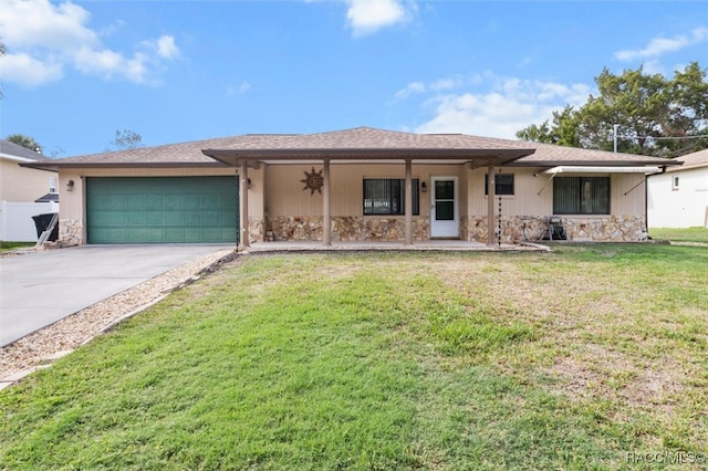 single story home featuring a porch, a garage, and a front lawn