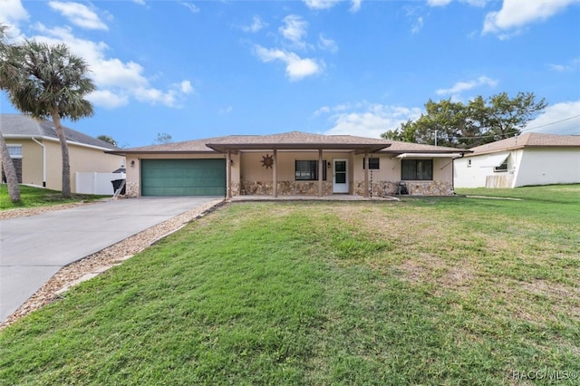 ranch-style house featuring a porch, a garage, and a front lawn