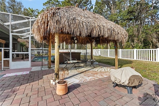 view of patio featuring a lanai, a fenced backyard, and a fenced in pool