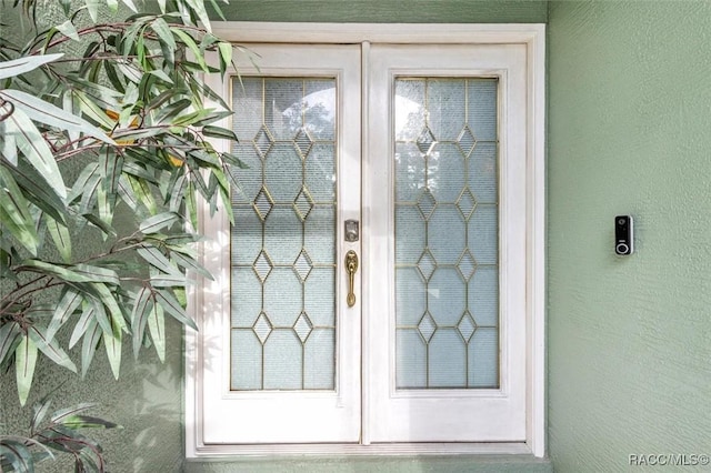 doorway to property with stucco siding