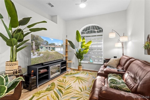 sitting room with visible vents and baseboards