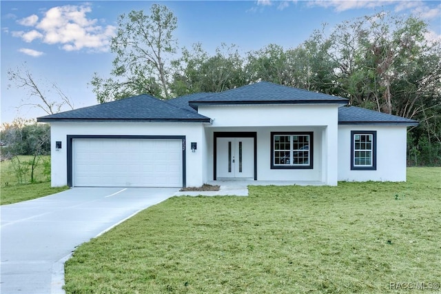 view of front facade with a front lawn and a garage