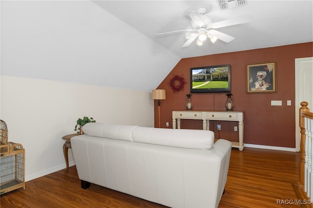 living room featuring dark hardwood / wood-style floors, ceiling fan, and vaulted ceiling