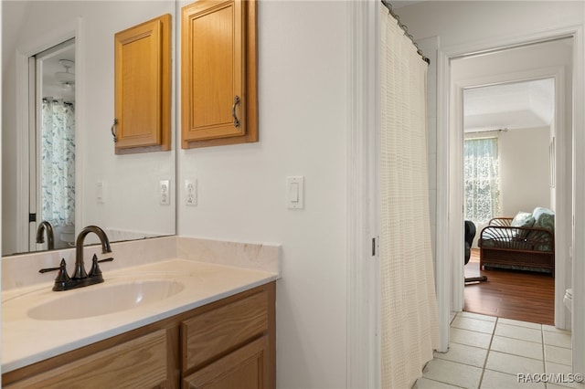 bathroom with tile patterned floors and vanity