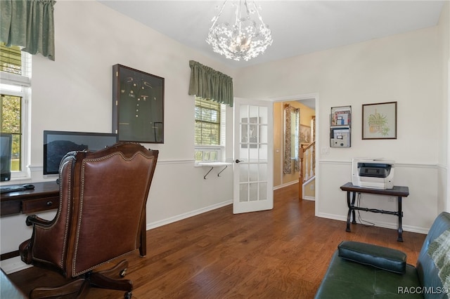 office with dark hardwood / wood-style flooring, plenty of natural light, french doors, and a notable chandelier