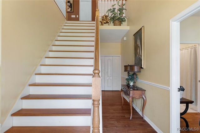 staircase featuring hardwood / wood-style floors