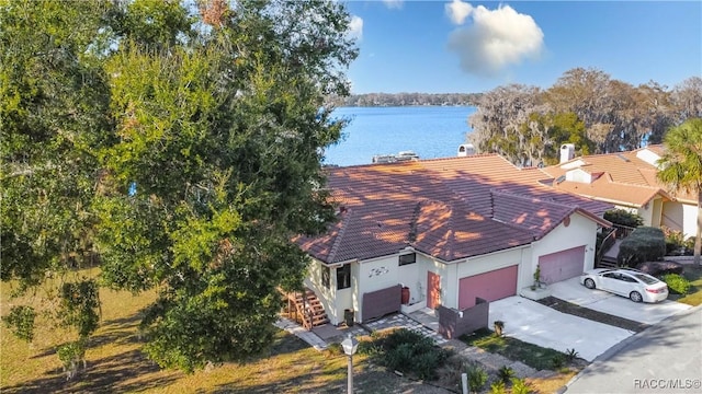 drone / aerial view with a water view