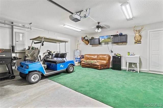 garage with a garage door opener and ceiling fan