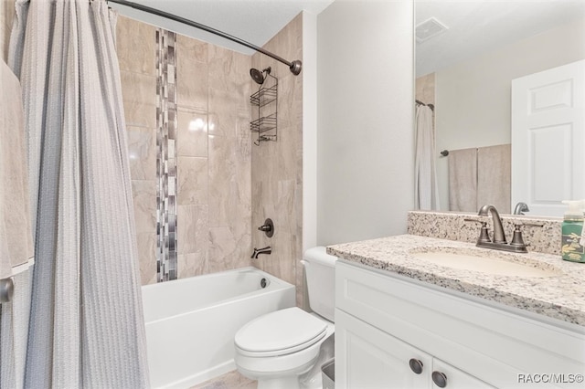 full bathroom with vanity, toilet, and shower / tub combo