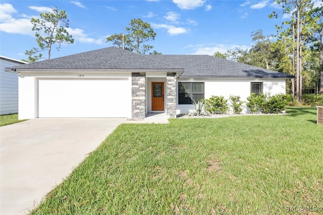 view of front of house featuring a garage and a front lawn