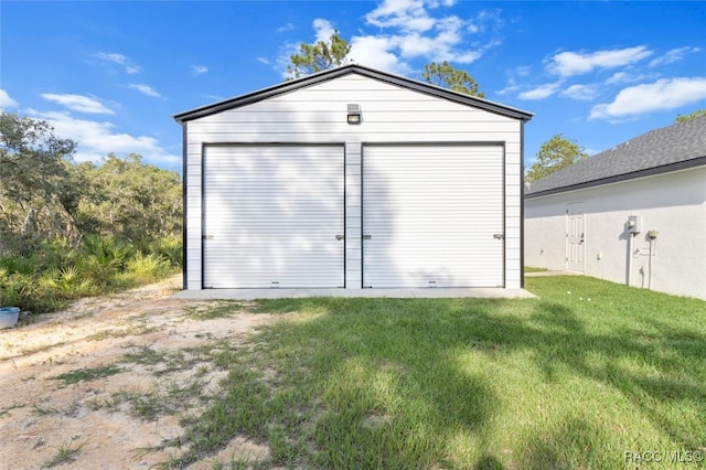 garage with a lawn