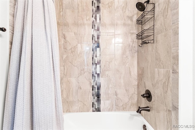 bathroom with shower / tub combo with curtain