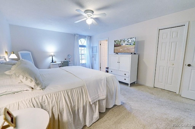 bedroom featuring light carpet and ceiling fan