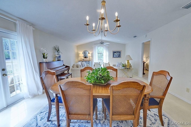 dining room with lofted ceiling, visible vents, an inviting chandelier, light carpet, and baseboards