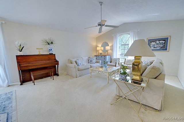 carpeted living room featuring lofted ceiling, ceiling fan, and baseboards