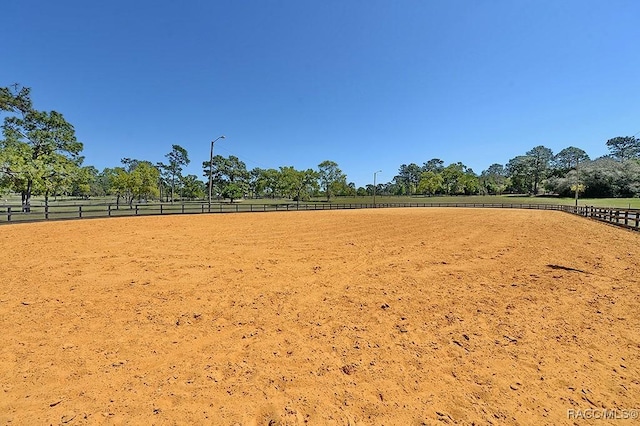 exterior space with an enclosed area and a rural view