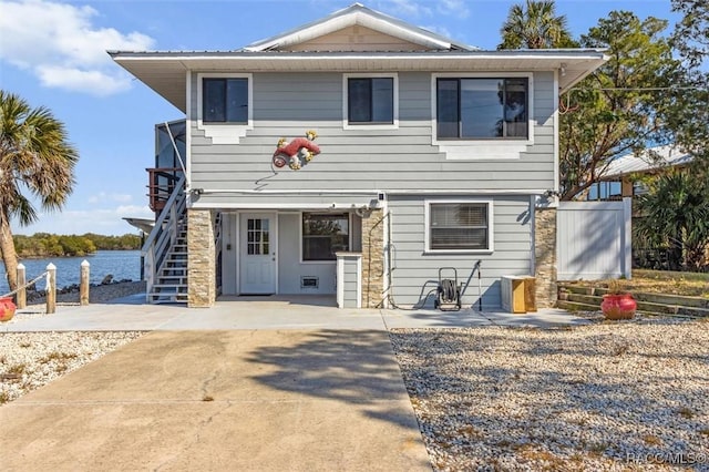 back of property with a water view