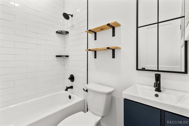 bathroom featuring toilet, bathtub / shower combination, and vanity