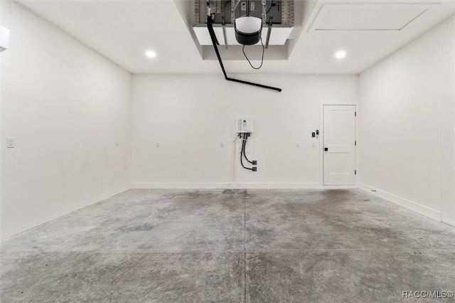 garage featuring recessed lighting and a garage door opener