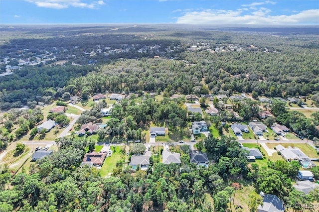 bird's eye view featuring a residential view and a forest view