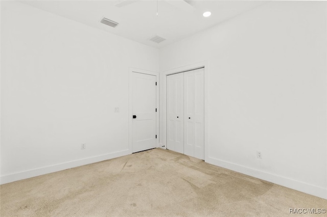 spare room with visible vents, baseboards, carpet flooring, and recessed lighting