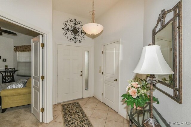 916 W Skyview Crossing Dr, Hernando, FL 34442 - foyer entrance with high vaulted ceiling and light tile patterned flooring