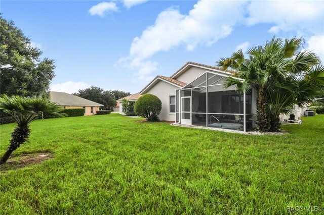 916 W Skyview Crossing Dr, Hernando, FL 34442 - view of grassy yard featuring a lanai