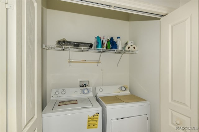 laundry area with washing machine and dryer