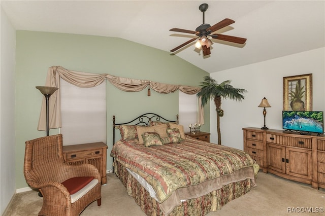 carpeted bedroom with vaulted ceiling and ceiling fan