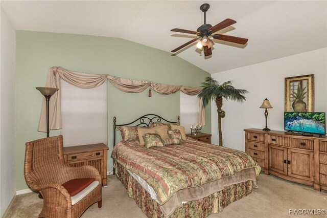 916 W Skyview Crossing Dr, Hernando, FL 34442 - bedroom featuring light colored carpet, vaulted ceiling, and a ceiling fan
