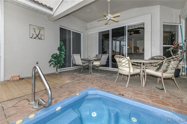 view of swimming pool with a patio and ceiling fan