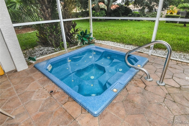 view of swimming pool featuring a yard and an in ground hot tub