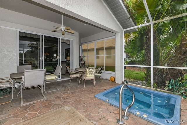 sunroom / solarium with ceiling fan and lofted ceiling