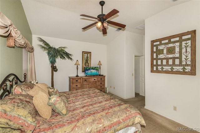 carpeted bedroom with ceiling fan and vaulted ceiling