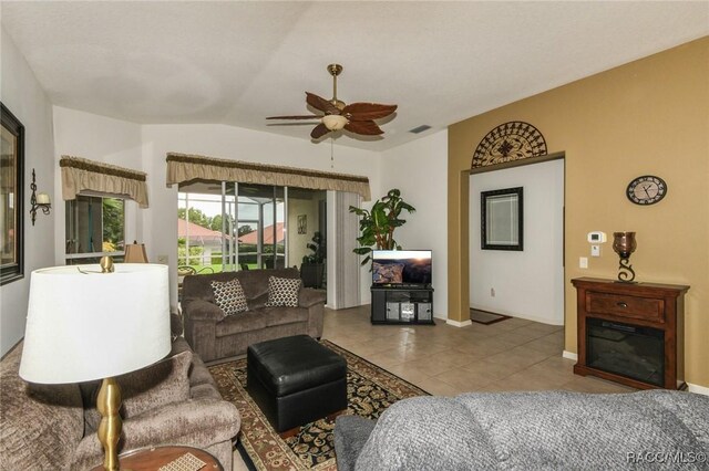 916 W Skyview Crossing Dr, Hernando, FL 34442 - living area featuring a ceiling fan, tile patterned flooring, lofted ceiling, and baseboards