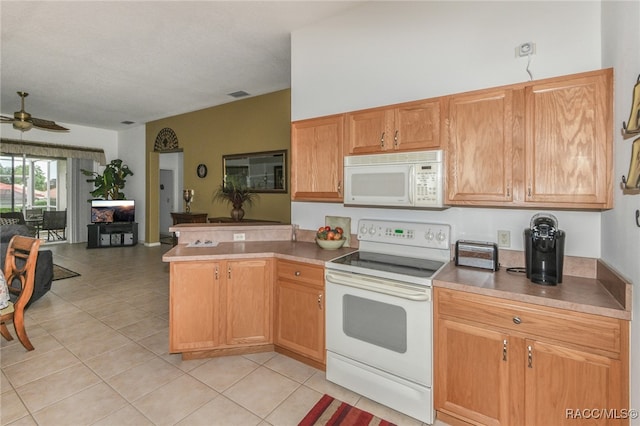 kitchen featuring kitchen peninsula, ceiling fan, light tile patterned floors, and white appliances