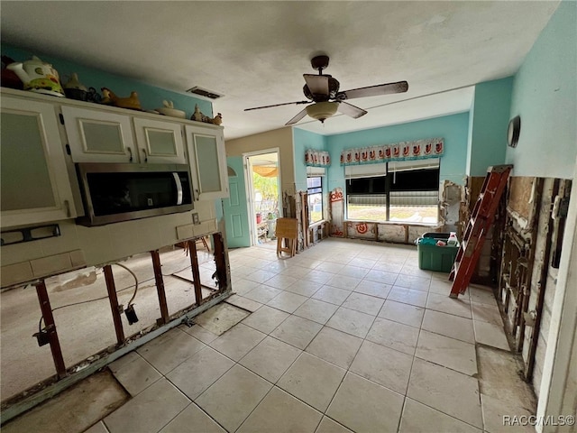 kitchen featuring ceiling fan and light tile patterned flooring