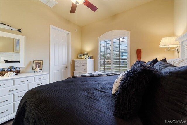 bedroom featuring vaulted ceiling and ceiling fan