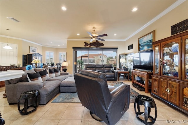 living room featuring ceiling fan, light tile patterned floors, and crown molding