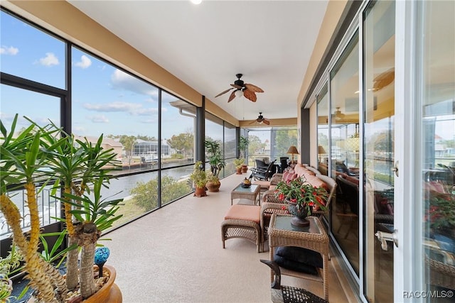 sunroom with ceiling fan and a wealth of natural light