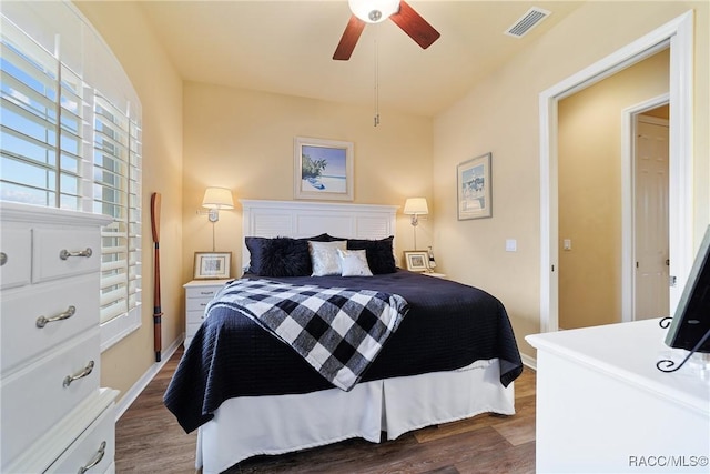 bedroom featuring ceiling fan and dark hardwood / wood-style floors