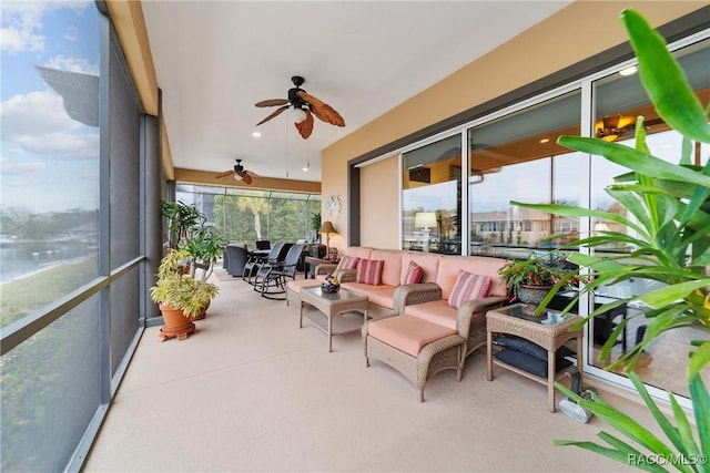 sunroom / solarium featuring ceiling fan