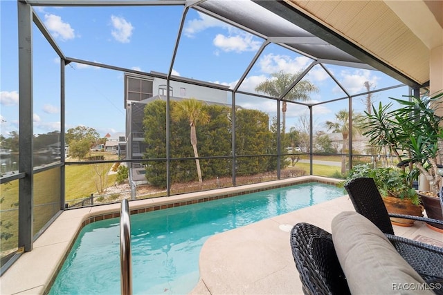 view of swimming pool featuring a lanai and a patio area